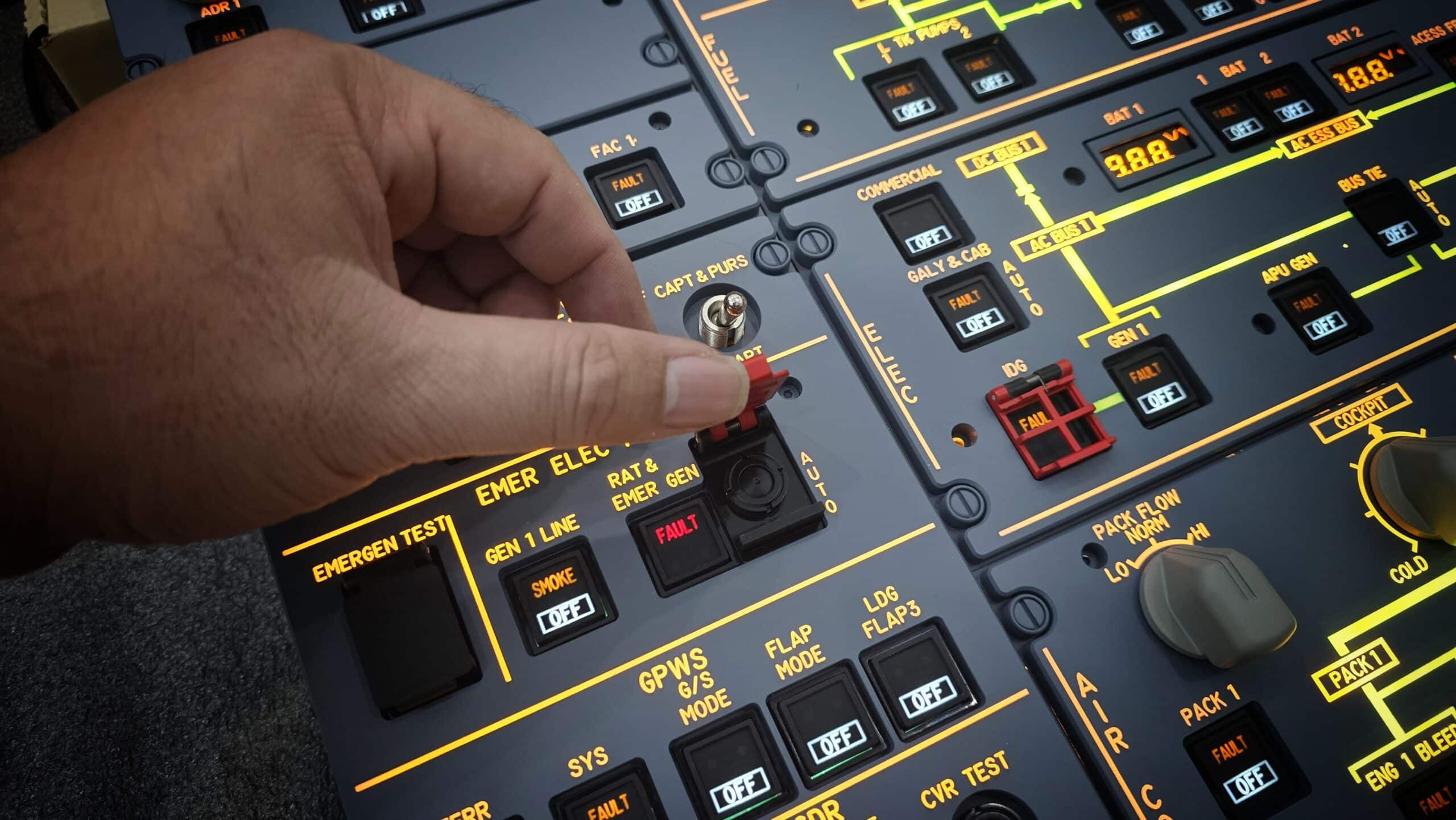 Close-up of A320 overhead panel switches and illuminated labels